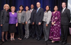 Diane Portnoy, ILC founder and CEO, left, and Marcia Drew Hohn, director of The ILC Public Education Institute, stand with 2014 ILC Immigrant Entrepreneur of the Year award winners Rosa Tejeda, Nisaury Tejeda, Fitzroy Alexander, Josef von Rickenbach, Victoria Amador and Dr. Fauzia Khan. At right is master of ceremonies Richard A. Davey, Jr., secretary and CEO, MA Department of Transportation, and ILC trustee.