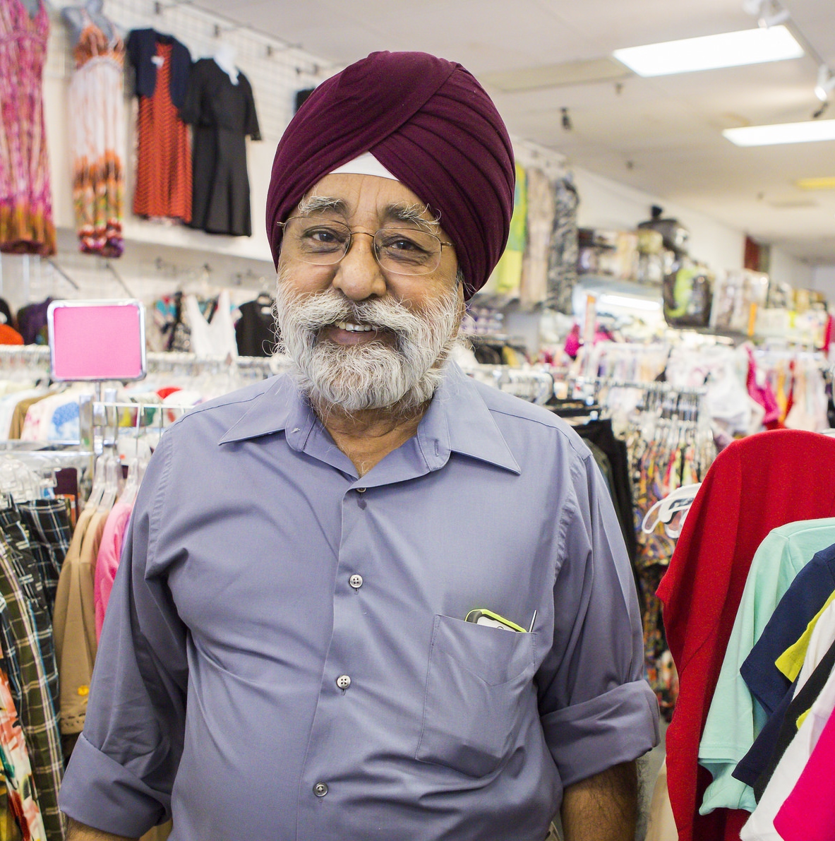 Local immigrant entrepreneur Raghbir Singh Grover in his business, Edson Fashion.