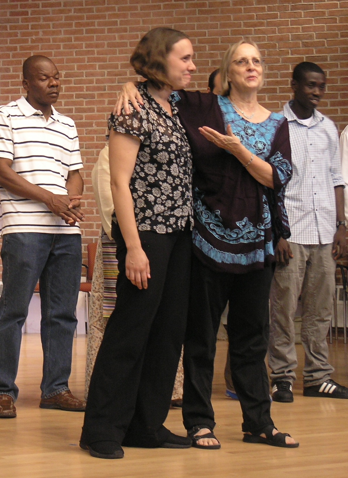 Kalthleen Klose turns over The ILC Immigrant Theater Class to Leora Sapon-Shevin