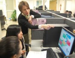 immigrant students and teacher in the computer lab