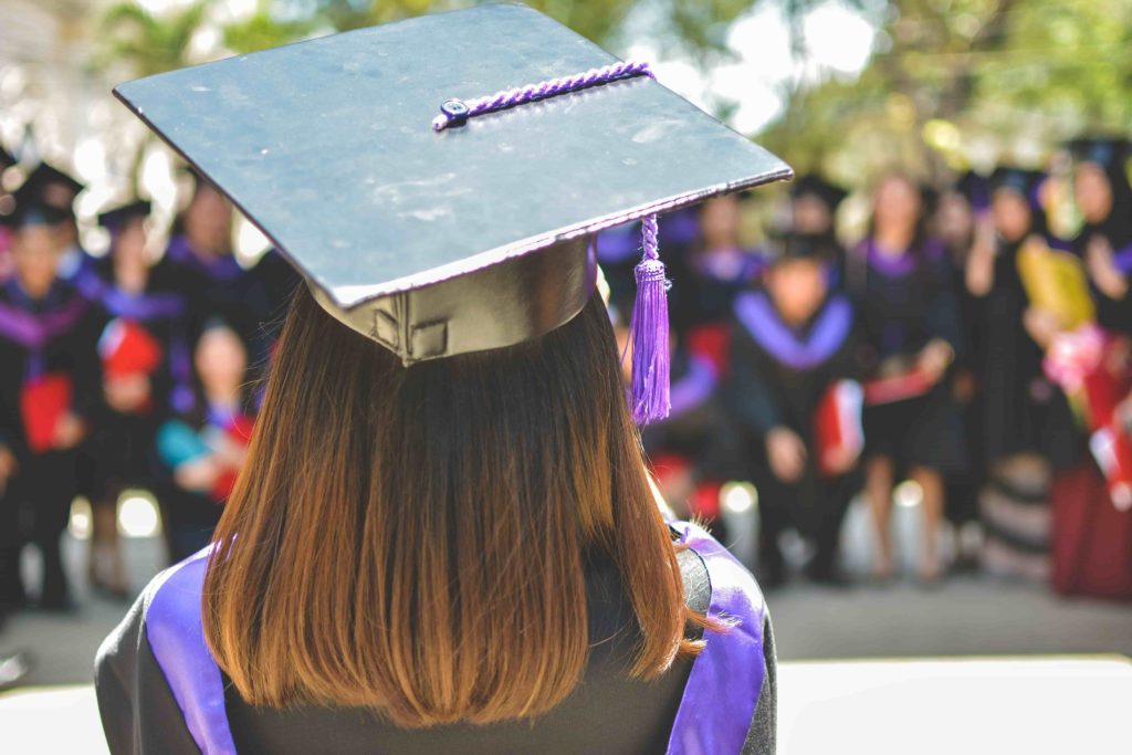 Woman in graduation cap and gown