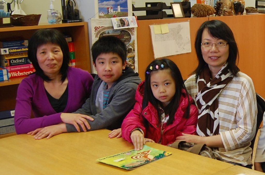 Family members and children at The Immigrant Learning Center.