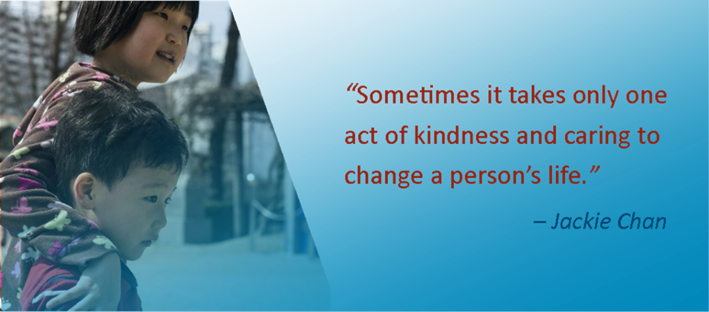 Picture of two children; "Sometimes it takes only one act of kindness and caring to change a person's life." - Jackie Chan