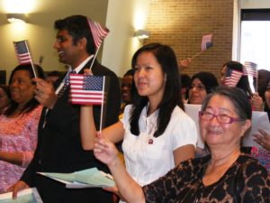 New citizens waving flags