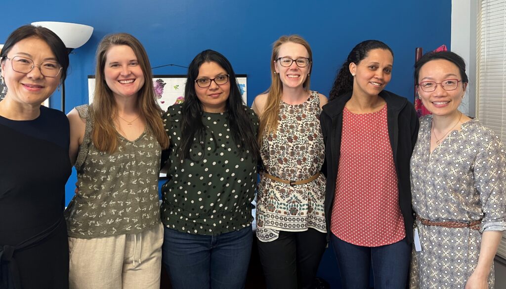 Students and advisors celebrating accounting program graduation